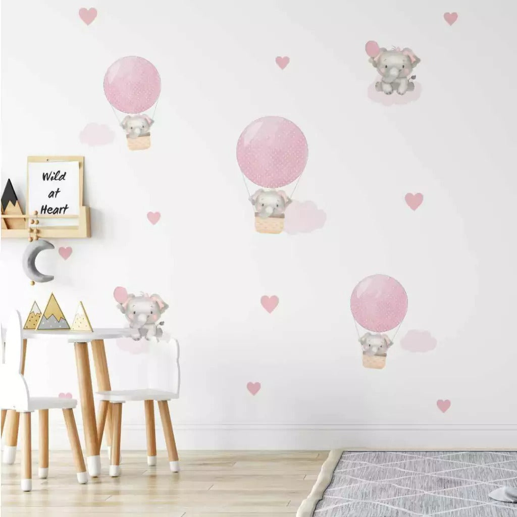 Combo de globos y elefantes con nubes rosas