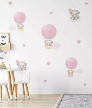 Combo de globos y elefantes con nubes rosas